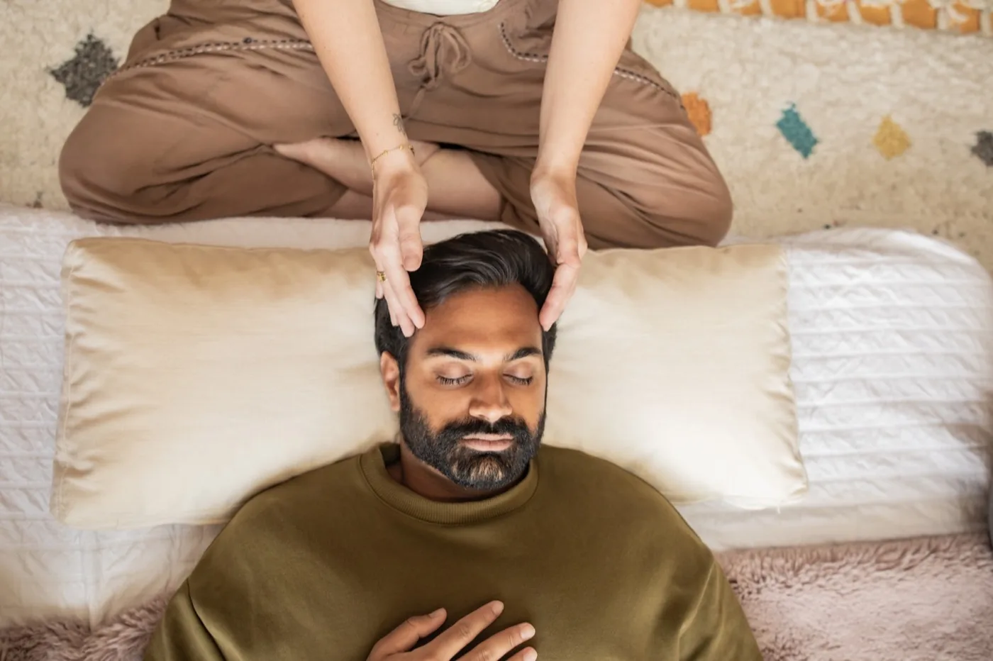A practitioner receiving a Reiki session at the Word of Mouth healing room in Los Angeles